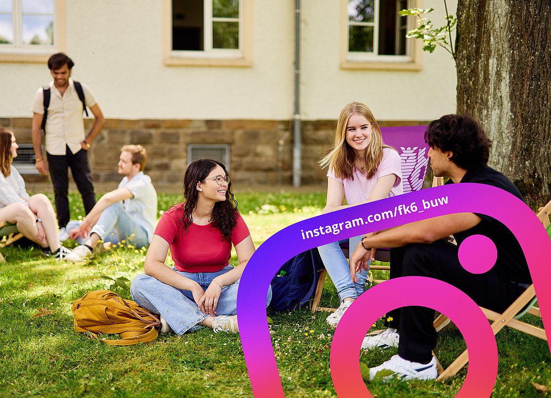 students sitting on lawn in the sun